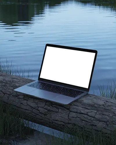Outdoor Lake Scene Macbook Pro M1 Mockup On Log With Calm Water And Evening Light