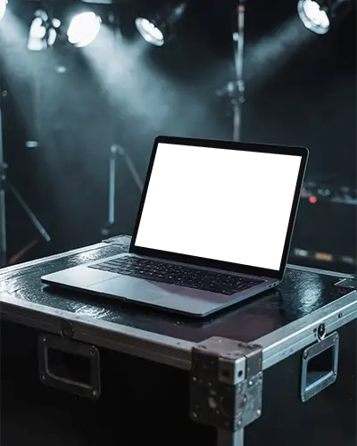 Macbook Pro M1 Mockup On Stage Equipment Case With Dramatic Concert Lighting Effect