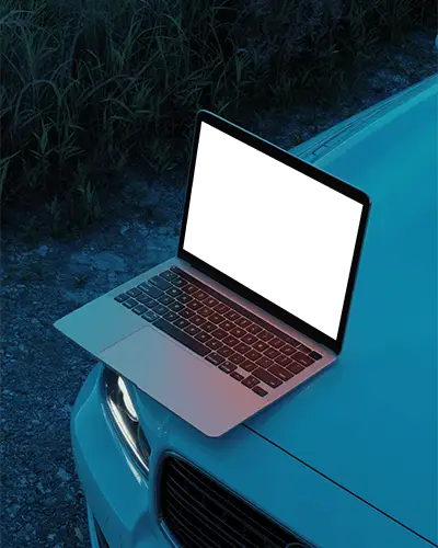 Blue Hour Macbook Pro M1 Mockup On Car Hood With Headlight Glow And Rural Gravel Road