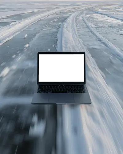 Macbook Pro M1 Mockup Floating Above Icy Road With Speed Motion And Snow Trail Pattern