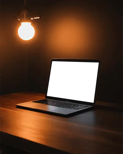 Warm Lamp Lit Desk Moody Nighttime Workspace Mockup Featuring M1 Air On Wooden Desk