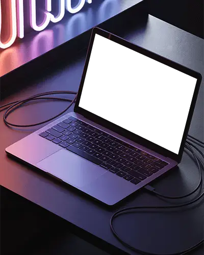 Macbook Pro M1 Mockup On Dark Desk Under Vibrant Neon Sign Lighting With Cable Setup