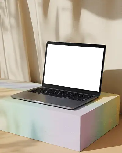 Macbook Pro M1 Mockup On Pastel Block With Curtain Shadows In Soft Natural Light Setting