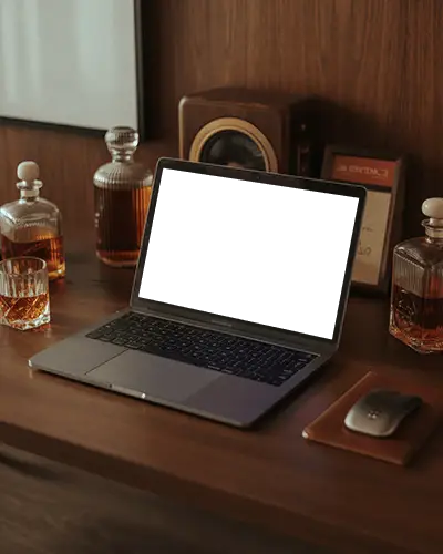 Macbook Air M1 Mockup On Wood Desk With Vintage Whiskey Decanters And Classic Speaker