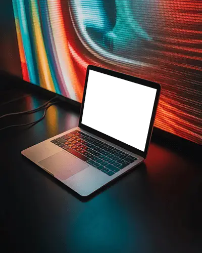 macbook-pro-m1-mockup-on-dark-table-with-colorful-led-screen-glow-and-modern-light-play