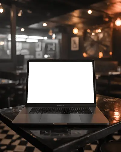 cozy-bar-mockup-scene-featuring-macbook-air-m1-on-worn-table-with-industrial-lighting