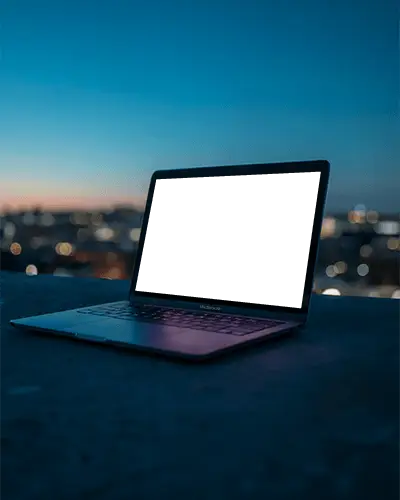 twilight-urban-scene-featuring-macbook-air-m1-on-concrete-rooftop-overlooking-city-glow