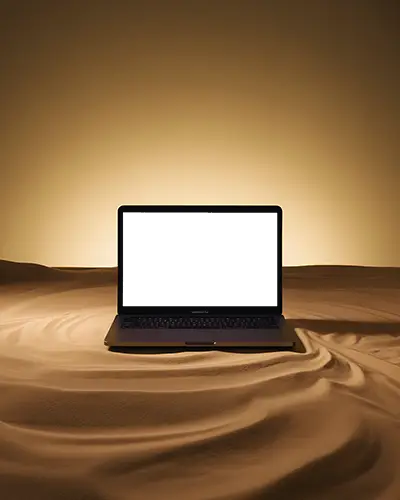 macbook-air-m1-laptop-centered-in-sandy-environment-with-soft-curves-and-warm-lighting