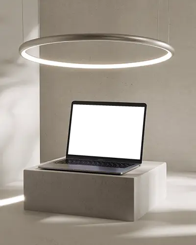 minimalist-macbook-m1-air-mockup-on-cement-block-under-glowing-halo-light-ring