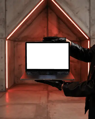 macbook-m1-pro-mockup-held-by-gloved-hands-in-front-of-concrete-wall-with-red-led-lines