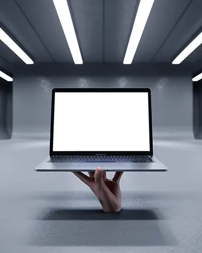hand-holding-macbook-air-m1-in-sci-fi-inspired-studio-with-smooth-metallic-walls-and-lights