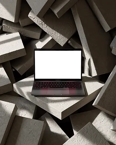 macbook-air-m1-mockup-on-angled-concrete-slab-stack-with-dramatic-light-shadow-texture-depth