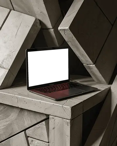 macbook-air-m1-mockup-in-brutalist-architecture-scene-with-stacked-stone-geometry