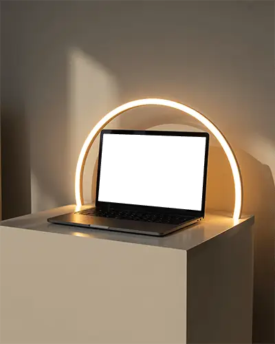 Luminous Arc Minimalist Desk Macbook M1 Pro Mockup With Soft Golden Halo Lighting