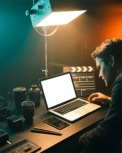 Director Workstation Macbook M1 Pro Mockup Surrounded By Lenses And Clapperboard