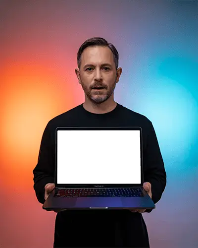 Studio Bicolor Glow M1 Air Mockup Presented By Man In Centered Composition