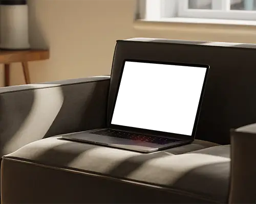 Macbook M1 Pro Mockup On Cozy Armchair With Soft Sunlight And Warm Relaxed Interior Tone