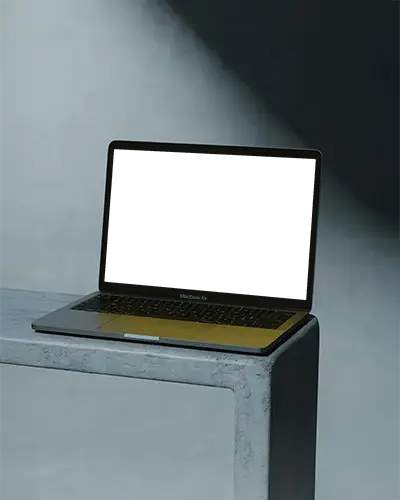 Macbook M1 Air Mockup On Concrete Surface With Dramatic Spotlight And Dark Minimal Aesthetic