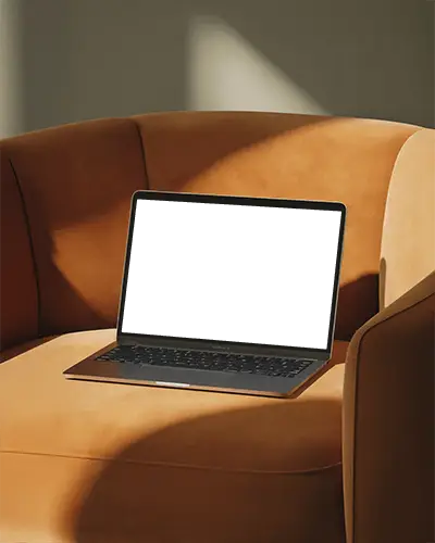 Macbook Air M1 Mockup On Warm Suede Chair With Soft Sunlight And Cozy Minimal Interior Tone