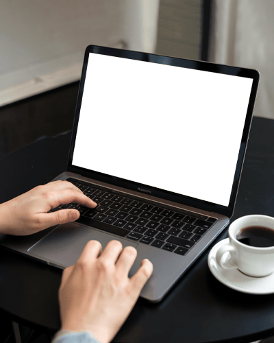 Cozy Workspace Macbook Mockup With Hands On Keyboard And Coffee Cup