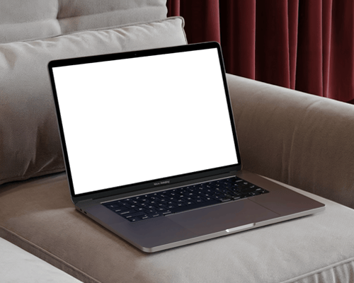 Cozy Home Macbook Mockup On Plush Sofa With Cushions In Background