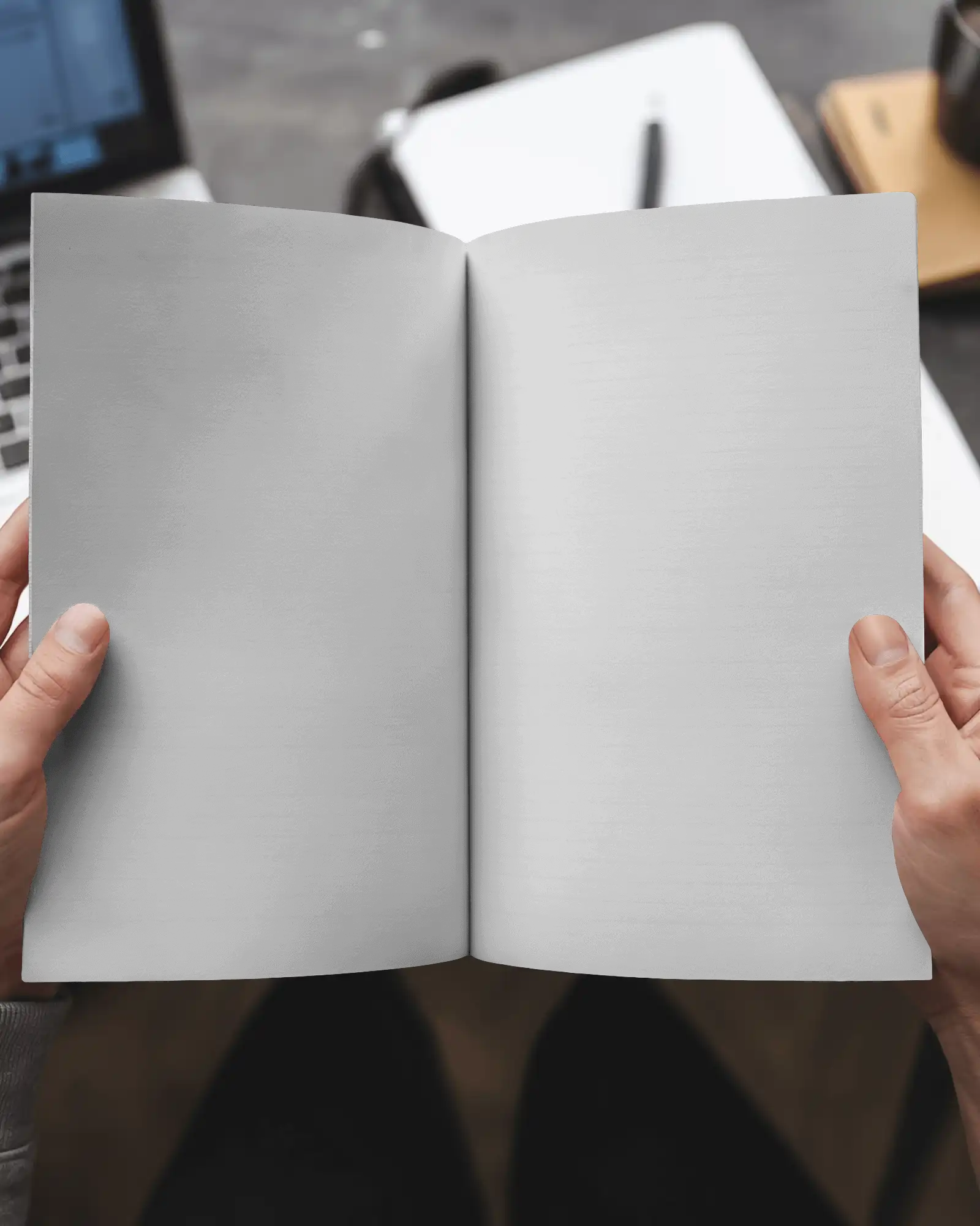 Open Spread Magazine Mockup White Pages Held By Hands Over Modern Workspace Setup