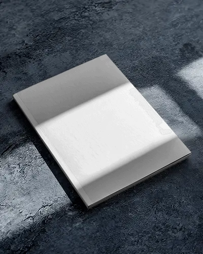 Minimalist Magazine Mockup On Dark Concrete Floor With Soft Window Shadows