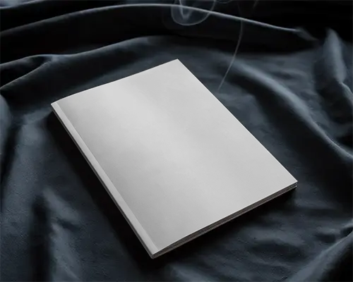 Angled Softcover Magazine Mockup On Dark Fabric Surface With Subtle Smoke Cozy And Moody Atmosphere 0204