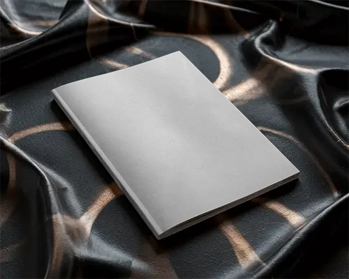 Stylish Magazine Cover Mockup On Rich Textured Black Fabric With Soft Reflective Light Rings 0214