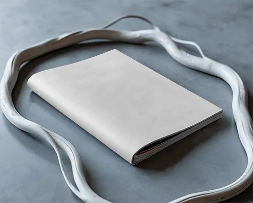 Flat Lay Minimal Magazine Mockup On Blue Stone Surface Surrounded By Curved White Frame 0248