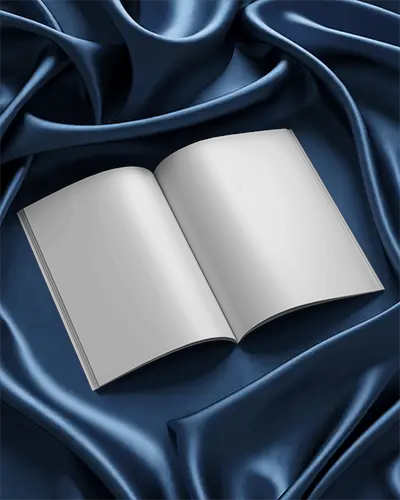 Open Magazine Mockup Resting On Smooth Luxury Navy Satin Textile With Soft Folds And Rich Shadows 0258