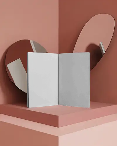 Soft Pink Corner Open Magazine Mockup On Podium With Decorative Mirrors And Muted Reflection For Modern Editorial Presentation 0285