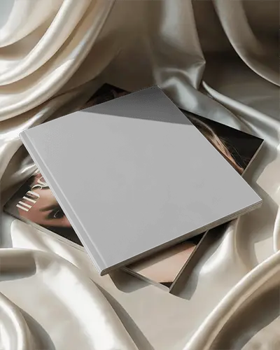 Elegant Top View Square Magazine Mockup On Stacked Issues With Cream Satin Background Soft Lighting Effect 0297