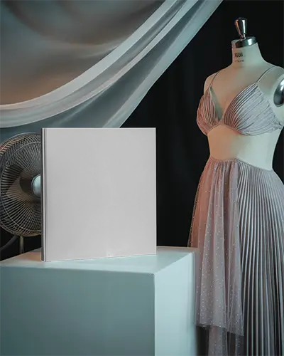 Fashion Studio Magazine Mockup Standing Cover With Mannequin And Pleated Gown Draped Silk Curtain Elegant Lighting Showcase 0312