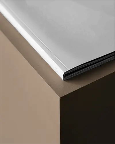 Sleek Minimalist Magazine Mockup On Edge Showcasing Modern Graphic Design And Clean Layout Style