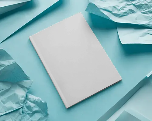 Realistic Magazine Mockup On Blue Paper Texture Background With Crumpled Sheets