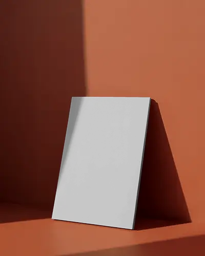 Elegant Magazine Mockup In Warm Studio Lighting Casting Soft Shadow On Modern Orange Background