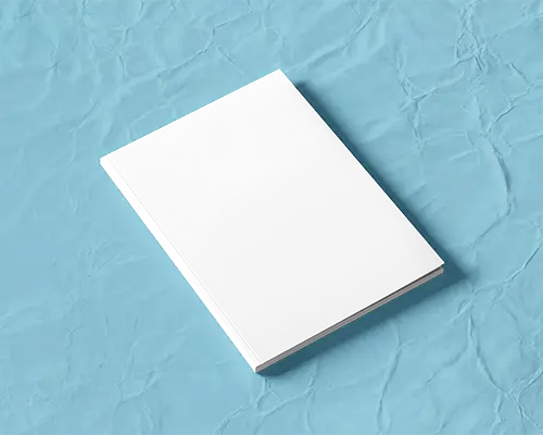 Magazine Mockup Floating Over Crumpled Blue Paper With Soft Light Reflection