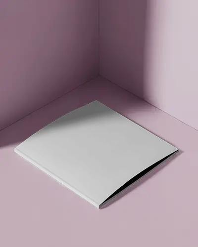 square-magazine-mockup-on-pink-corner-floor-with-shadow-casting-and-subtle-light-reflection