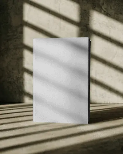 standing-magazine-mockup-with-natural-light-and-shadow-background-for-design-presentation