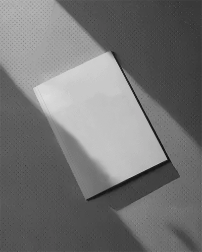 Elegant Closed Magazine Mockup With Shadow Play On Patterned Surface For Design Presentations