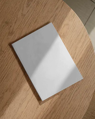 Magazine Mockup On Wooden Table With Sunlight Shadows