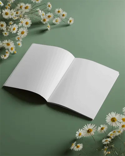 Top View Of Blank Magazine Mockup On Table With Daisy Flower Arrangement