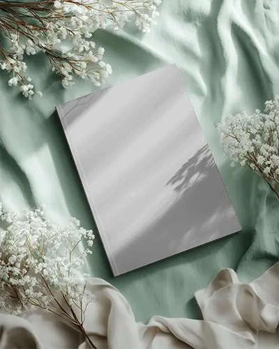 Sleek Minimalistic Magazine Mockup On Soft Fabrics With Floral Decor Perfect For Design Presentation