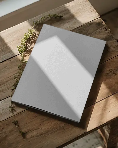 Minimalist Clean Magazine Mockup On Natural Wooden Table With Soft Natural Light And Herbs