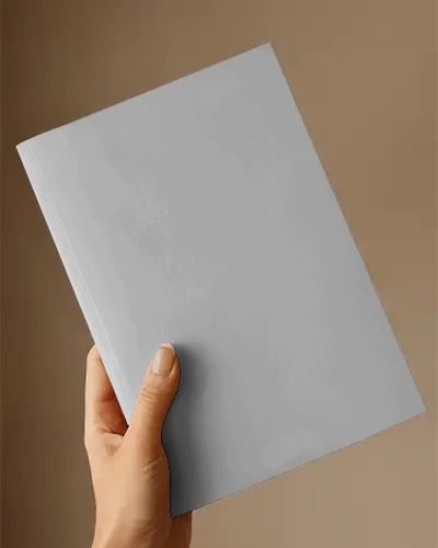 Hand Holding Thick Softcover Magazine Mockup For Design Presentation