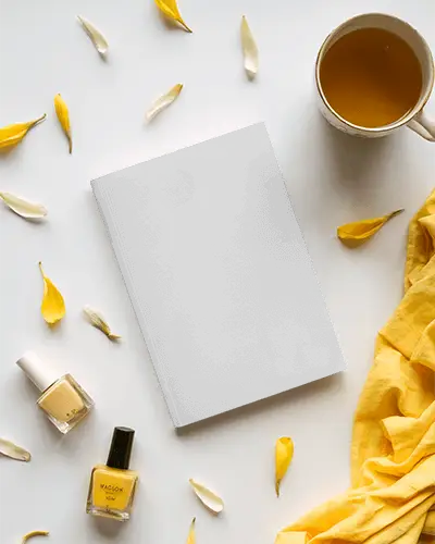 Elegant Softcover Magazine Mockup Surrounded By Yellow Themed Accessories