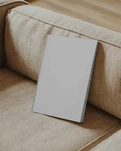 Modern Magazine Mockup Placed On Sofa For Elegant Branding And Marketing Presentation Design