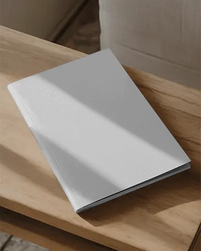 Sleek Hardcover Magazine Mockup On Wooden Table With Natural Light And Clean Background