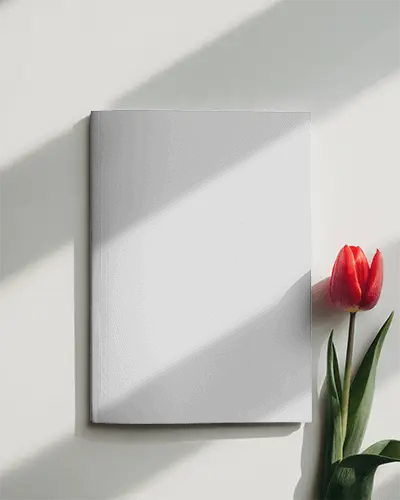 Minimalist Hardcover Magazine Mockup With Natural Light And Flower Element For Design